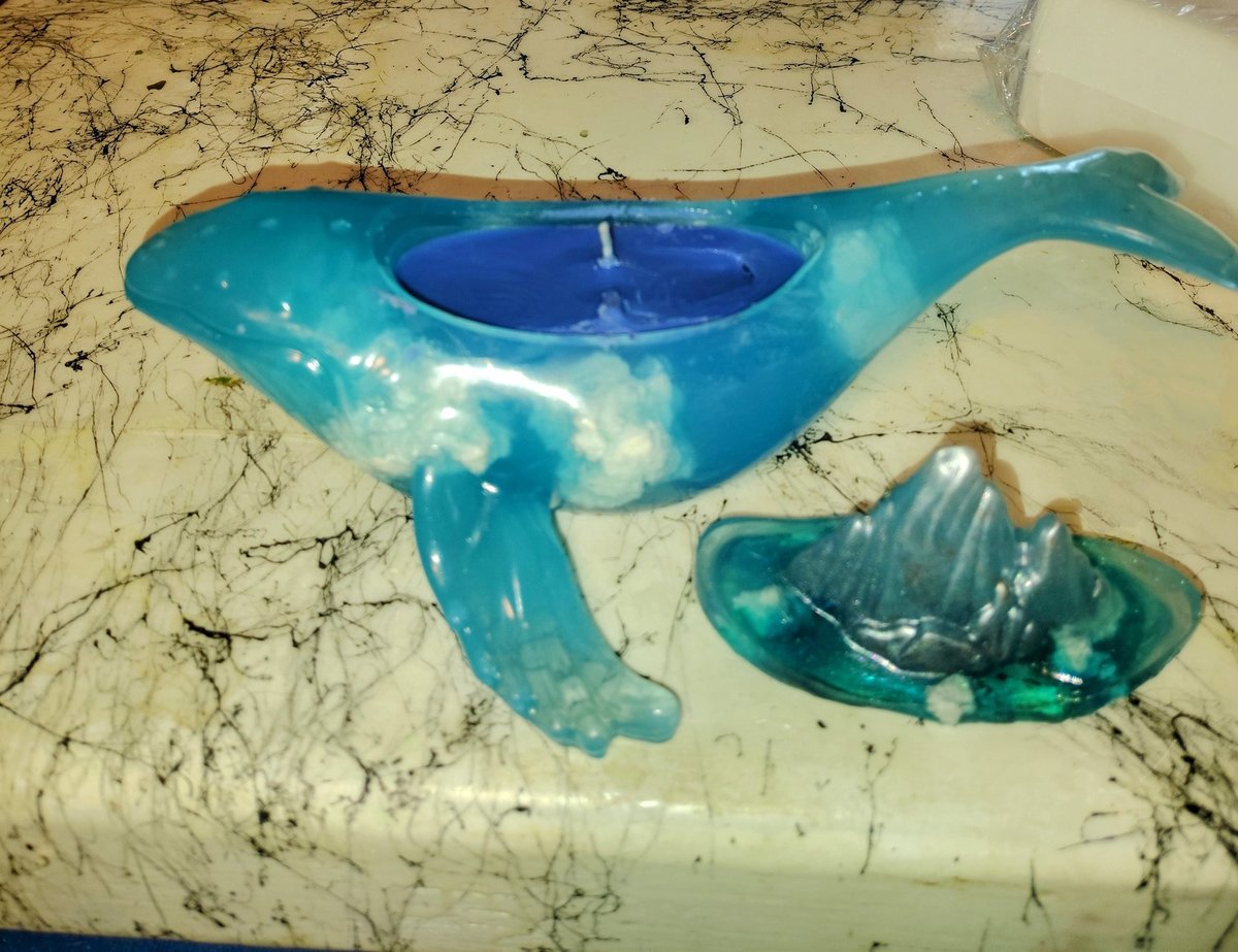 Whale with floating clouds on the inside planter