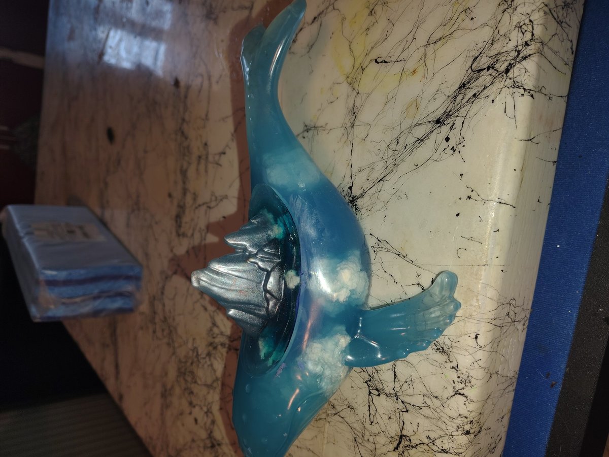 Whale with floating clouds on the inside planter