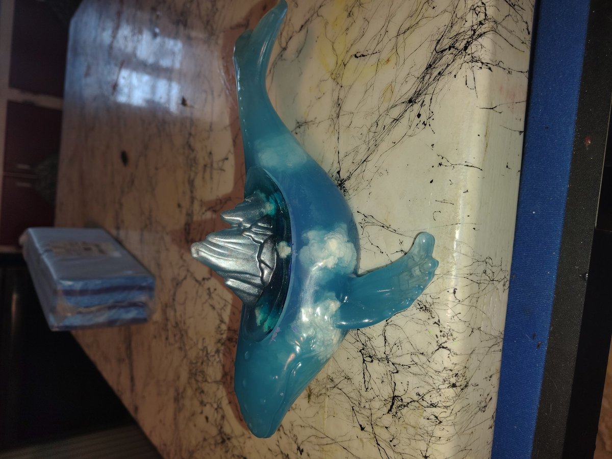 Whale with floating clouds on the inside planter